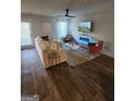 Spacious living room with stylish furniture, a ceiling fan, and lots of natural light at 4838 Station Lane # 15, Union City, GA 30349