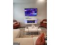Well-designed living room featuring cozy seating, a modern fireplace, and a large-screen TV at 4838 Station Lane # 15, Union City, GA 30349