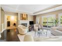 Bright living room featuring a fireplace, hardwood floors, recessed lighting, and a comfortable seating arrangement at 3192 Paces Mill Se Rd, Atlanta, GA 30339