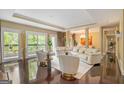 Elegant living room featuring hardwood floors, recessed lighting, large windows and a comfortable seating arrangement at 3192 Paces Mill Se Rd, Atlanta, GA 30339