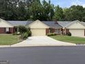 Attractive brick and siding home with a well-kept lawn and a paved driveway at 6190 Douglas Manor Ct, Douglasville, GA 30134