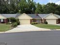 Attractive brick and siding home with a well-kept lawn and a paved driveway at 6190 Douglas Manor Ct, Douglasville, GA 30134