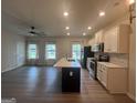 Spacious kitchen with a large island, black stainless steel appliances, and recessed lighting at 2108 Remy Ct, Kennesaw, GA 30144
