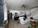 Inviting living space featuring an open-concept design, modern finishes, and plenty of natural light at 2108 Remy Ct, Kennesaw, GA 30144