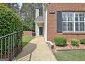 Inviting entrance with lush greenery and a well-maintained walkway to the front door at 1801 Ridgefield Dr, Peachtree City, GA 30269