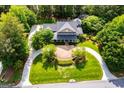 Overhead view of a beautiful landscaped home with a circular driveway at 115 Champion Dr, Carrollton, GA 30116