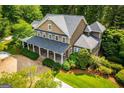 Stately home with covered front porch and meticulously landscaped yard at 115 Champion Dr, Carrollton, GA 30116