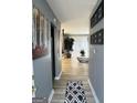 Inviting entryway with stylish decor, leading into a well-lit living area at 5894 Par Three Ct, Lithonia, GA 30038