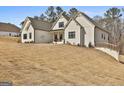 A beautifully constructed one-story home with painted brick exterior and a gently sloping lawn at 135 Wet Wood Dr # 12, Fairburn, GA 30213