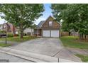 Brick home with a well-maintained front yard and driveway at 1871 Sandy Trail Dr, Hampton, GA 30228