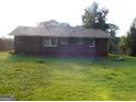 Large backyard with full lawn and brick exterior at 5243 Eubanks Dr, Lake City, GA 30260