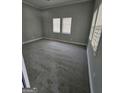 Neutral bedroom featuring plush carpeting, base molding, and two windows offering lots of natural light at 937 Sw Metropolitan Sw, Atlanta, GA 30310