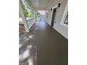 Expansive covered front porch featuring neutral paint, horizontal railing, and large square columns at 937 Sw Metropolitan Sw, Atlanta, GA 30310