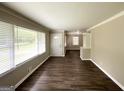 Spacious living area with hardwood floors, large windows, and a view to an additional room at 2165 Pemberton Rd, Atlanta, GA 30331