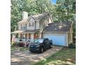 Beautiful home with an attached garage and a well-maintained lawn, nestled among mature trees at 190 Princeton Way, Covington, GA 30016