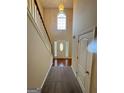 Inviting foyer with high ceilings, hardwood floors, and a grand staircase at 4551 Mitchells Meadow Ln, Ellenwood, GA 30294