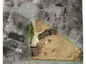 Aerial view of property showing the home, detached garage, driveway, and expansive yard within outlined property lines at 183 Brookwood Estates Trl, Stockbridge, GA 30281