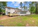 Spacious backyard with a wooden deck perfect for outdoor entertaining and relaxation at 101 Jasmine Path, Peachtree City, GA 30269
