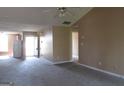 Open living room with neutral walls and carpet offers a versatile living space at 5799 Eagles Feather Ln, Riverdale, GA 30274