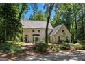 Beautiful home featuring mature landscaping and a driveway at 1260 Heards Ferry Rd, Sandy Springs, GA 30328