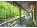 Inviting front porch with swing and views of lush green yard at 465 Willowbrook Dr, Smyrna, GA 30082