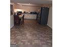 Basement kitchen with tile flooring and matching black appliances at 1071 Ponderosa Park Dr, Forest Park, GA 30297