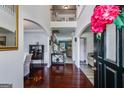 Grand foyer with gleaming hardwood floors, arched entryways, and a view of the upper level at 7115 Secret Rose, Douglasville, GA 30134