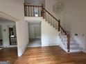 Spacious foyer with hardwood floors, staircase, and chandelier at 2451 Old Salem Se Cir, Conyers, GA 30013