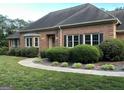 A beautiful brick home with neat landscaping and a curved walkway leading to the inviting front entrance at 2451 Old Salem Se Cir, Conyers, GA 30013