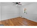 Clean bedroom with hardwood floors and ample natural light from a large window at 2609 Lake Harbin Rd, Morrow, GA 30260