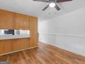 The dining room is adjacent to the kitchen and has wood flooring at 2609 Lake Harbin Rd, Morrow, GA 30260