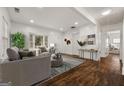 Open living room with hardwood floors, bay window, and stylish decor at 2584 Oldknow Nw Dr, Atlanta, GA 30318