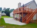 Spacious backyard featuring a wooden deck perfect for outdoor entertaining and relaxation at 95 Revere Turn Drive, Fairburn, GA 30213