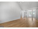 Bright, open-concept living room with hardwood floors and natural light at 1155 Graystone Xing, Alpharetta, GA 30005