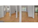 Bright, open-concept living room with wood flooring, featuring columns for definition at 1155 Graystone Xing, Alpharetta, GA 30005