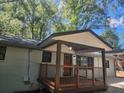 Inviting covered porch with wood decking and classic railing at 2953 Meadowview Se Dr, Atlanta, GA 30316