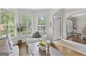 Bright living room with white walls, large windows, and modern furnishings at 240 Longmead Dr, Fayetteville, GA 30215