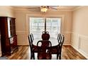 Dining room with a large table, hutch, and sliding doors that let in natural light at 101 Bluegill Trce, Peachtree City, GA 30269