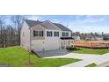 Two-story home with a two-car garage and fresh landscaping at 1950 Van Allen Ct, Dacula, GA 30019