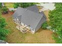 Backyard featuring a covered patio with seating, perfect for outdoor gatherings and relaxation at 556 Walton Dr, Social Circle, GA 30025