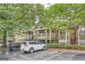 Exterior view of condo buildings featuring guest parking, balconies, and meticulously maintained landscaping at 578 Mcgill Ne Pl # 578, Atlanta, GA 30312