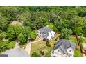 A beautiful two-story home with mature trees and landscaping in a quiet neighborhood at 9206 Denmeade Trce, Douglasville, GA 30135