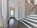 Inviting foyer with hardwood floors, a staircase, and a view of the front door at 1020 Broadview Dr, Marietta, GA 30062