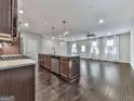 Modern kitchen with stainless steel appliances and a spacious island for cooking and entertaining at 1020 Broadview Dr, Marietta, GA 30062