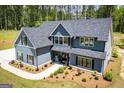 Aerial view of the home highlighting the landscaped yard and the home's architectural details at 457 Paynes Lake Rd, Carrollton, GA 30116