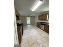 Well-lit kitchen featuring tile floors, stainless steel appliances, and a ceiling fan at 686 Favorwood Sw Dr, Marietta, GA 30060