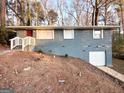 Brick home with a garage and retaining wall at 4366 Glenwood Pkwy, Decatur, GA 30032