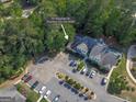 Aerial view of 701 Ridgelake Dr showcasing ample parking and wooded surroundings in Peachtree City at 701 Ridgelake Dr, Peachtree City, GA 30269