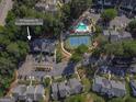 Aerial view of community amenities including a tennis court and pool near 701 Ridgelake Dr at 701 Ridgelake Dr, Peachtree City, GA 30269