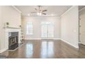 Bright living area with fireplace, hardwood floors, and access to a patio enhancing the comfort and appeal at 1106 Bakary Ct, Decatur, GA 30032